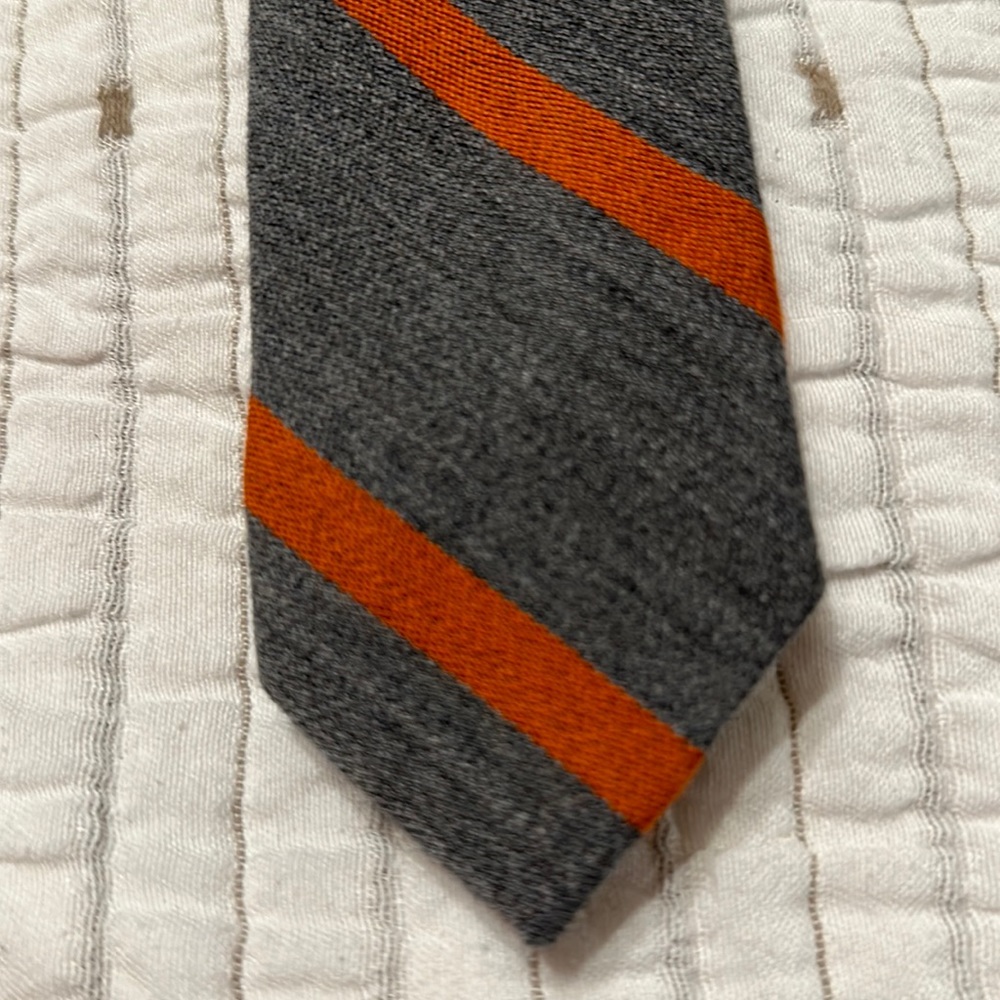 Men’s tie. Gray with orange stripes. Wool. J. Crew.